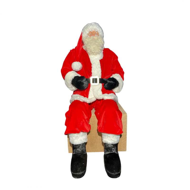 Pere Noel rouge assis
